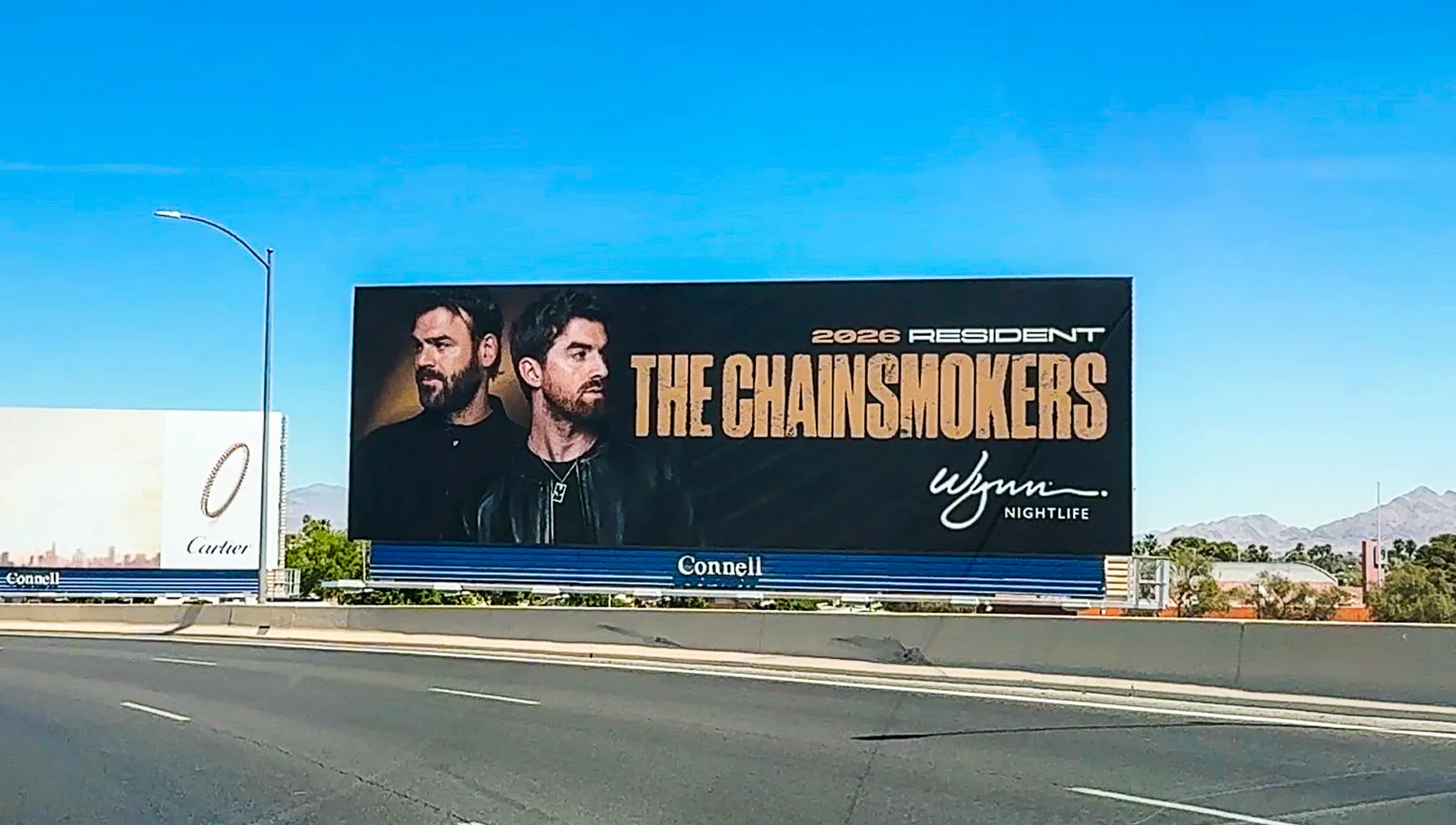 The Chainsmokers 2026 Wynn Nightlife residency billboard along a Las Vegas freeway.